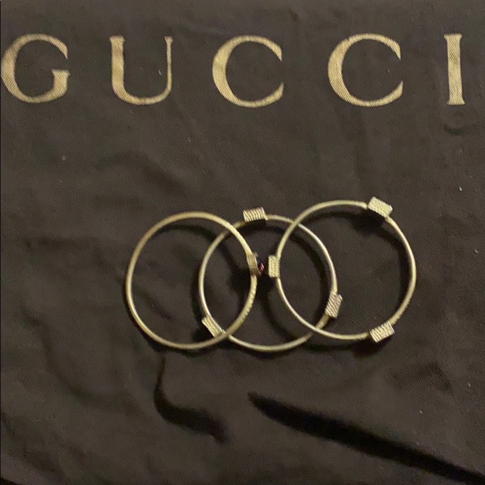 Set of 3 gold bangles with semi precious stones